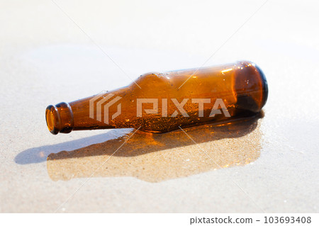 Glass bottle on the beach Glass bottle on the beach 103693408