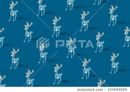 Pattern with white deer with silver antlers on a blue background Pattern with white deer with silver antlers on a blue background 103694099