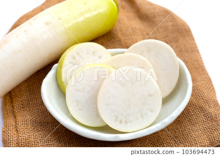 Sliced Japanese daikon. Fresh vegetables 103694473