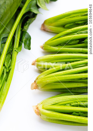 Fresh spinach on white background Fresh spinach on white background 103694648