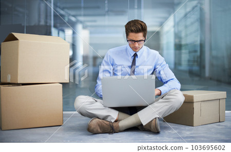 Moving box, office laptop and man typing business report, statistics analysis or search online, internet or website info. Relocation, cardboard boxes and male businessman, employee or person working Moving box, office laptop and man typing business report, statistics analysis or search online, internet or website info. Relocation, cardboard boxes and male businessman, employee or person working 103695602