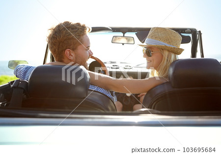 Car road trip, travel and back of couple on bonding holiday adventure, transportation journey or fun summer vacation. Love flare, convertible vehicle and happy driver driving in countryside 103695684