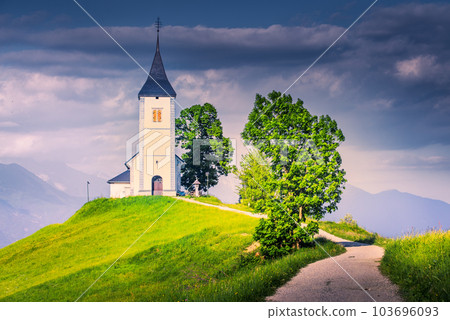 Jamnik. Charming 15th-century church with stunning Alps views in Slovenia. 103696093