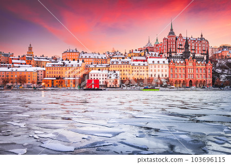 Stockholm, Sweden. Sunset with  Mariaberget downtown  and frozen Lake Malaren 103696115