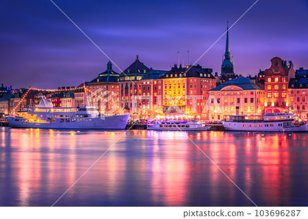Stockholm, Sweden. Sunset over Gamla Stan, water reflection downtown. Stockholm, Sweden. Sunset over Gamla Stan, water reflection downtown. 103696287