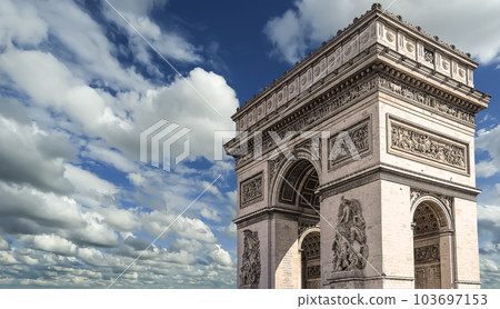 Arc de Triomphe (against the background of sky with clouds), Paris, France. The walls of the arch are engraved with the names of 128 battles and names of 660 French military leaders (in French) Arc de Triomphe (against the background of sky with clouds), Paris, France. The walls of the arch are engraved with the names of 128 battles and names of 660 French military leaders (in French) 103697153