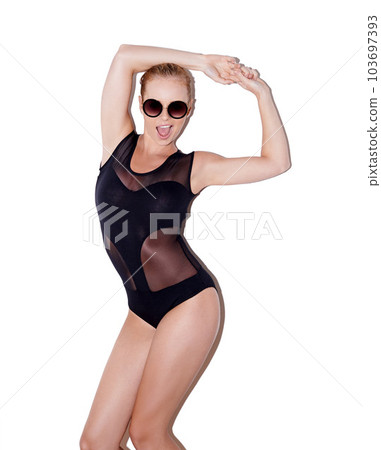 Woman model, bodysuit and sunglasses or trendy pose for fashion and with attitude isolated on white background. Face, body and fit legs or hot lady and glamour or lingerie on studio or shades 103697393
