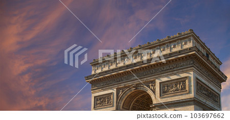 Arc de Triomphe (against the background of sky with clouds), Paris, France. The walls of the arch are engraved with the names of 128 battles and names of 660 French military leaders (in French) 103697662