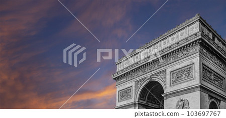 Arc de Triomphe (against the background of sky with clouds), Paris, France. The walls of the arch are engraved with the names of 128 battles and names of 660 French military leaders (in French) 103697767