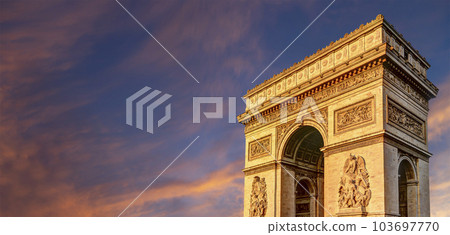 Arc de Triomphe (against the background of sky with clouds), Paris, France. The walls of the arch are engraved with the names of 128 battles and names of 660 French military leaders (in French) 103697770