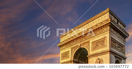 Arc de Triomphe (against the background of sky with clouds), Paris, France. The walls of the arch are engraved with the names of 128 battles and names of 660 French military leaders (in French) 103697772