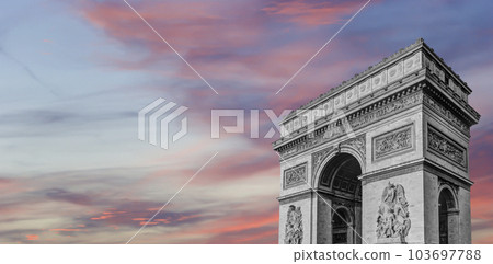 Arc de Triomphe (against the background of sky with clouds), Paris, France. The walls of the arch are engraved with the names of 128 battles and names of 660 French military leaders (in French) 103697788