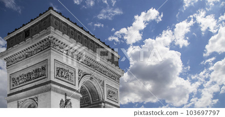 Arc de Triomphe (against the background of sky with clouds), Paris, France. The walls of the arch are engraved with the names of 128 battles and names of 660 French military leaders (in French) Arc de Triomphe (against the background of sky with clouds), Paris, France. The walls of the arch are engraved with the names of 128 battles and names of 660 French military leaders (in French) 103697797