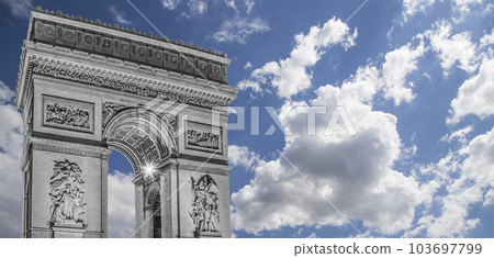 Arc de Triomphe (against the background of sky with clouds), Paris, France. The walls of the arch are engraved with the names of 128 battles and names of 660 French military leaders (in French) Arc de Triomphe (against the background of sky with clouds), Paris, France. The walls of the arch are engraved with the names of 128 battles and names of 660 French military leaders (in French) 103697799