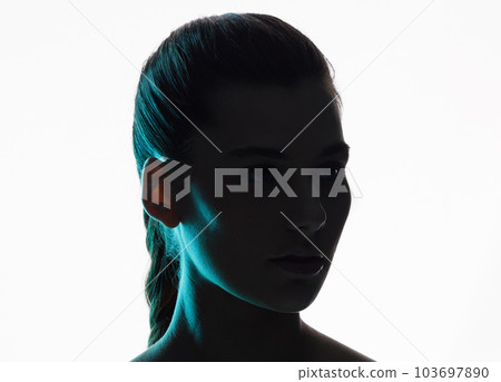 Beauty is bold. Beauty is bright. Cropped shot of an attractive young woman posing in studio against a bright background. 103697890
