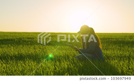 woman farmer works digital tablet. agronomist green wheat sunset. farming. griculture. eco cultural modern farm concept. modern technology smart digital agriculture tablet. agronomist farmer worker woman farmer works digital tablet. agronomist green wheat sunset. farming. griculture. eco cultural modern farm concept. modern technology smart digital agriculture tablet. agronomist farmer worker 103697949
