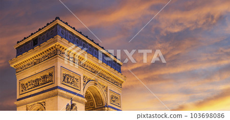 Arc de Triomphe (against the background of sky with clouds), Paris, France. The walls of the arch are engraved with the names of 128 battles and names of 660 French military leaders (in French) 103698086