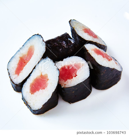 Traditional Japanese maki rolls with tuna on a white background. 103698743