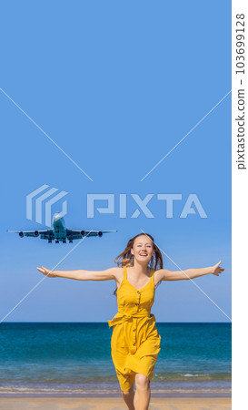 Woman have fun on the beach watching the landing planes. Traveling on an airplane concept. Text space. Island Phuket in Thailand. Impressive paradise. Hot beach Mai Khao. Amazing landscape VERTICAL Woman have fun on the beach watching the landing planes. Traveling on an airplane concept. Text space. Island Phuket in Thailand. Impressive paradise. Hot beach Mai Khao. Amazing landscape VERTICAL 103699128