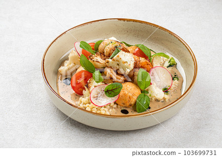 Portion of dish with ptitim and seafood Portion of dish with ptitim and seafood 103699731