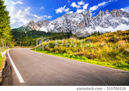 Nova Levante, Italy. Bolzano region scenery with Cimon del Latemar, Dolomites mountains. Nova Levante, Italy. Bolzano region scenery with Cimon del Latemar, Dolomites mountains. 103700326