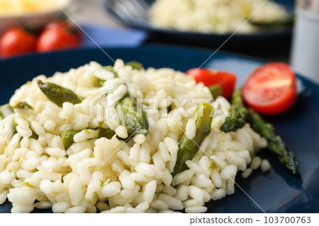 Delicious risotto with asparagus in plate, closeup Delicious risotto with asparagus in plate, closeup 103700763