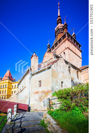 Sighisoara, Romania. Clock Tower in famous stone-walled city of Transylvania. Sighisoara, Romania. Clock Tower in famous stone-walled city of Transylvania. 103701905