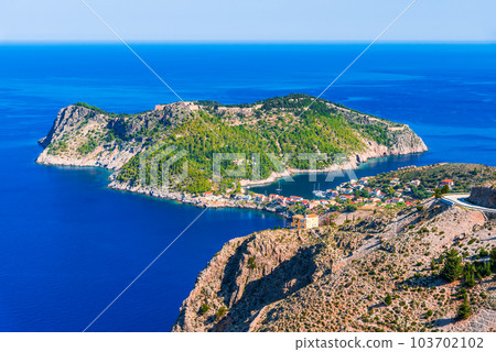 Assos, Greece. Picturesque village nestled on the idyllic Cephalonia, Ionian Islands. 103702102