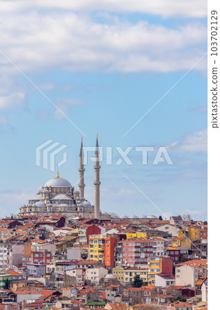 Suleymaniye mosque with colorful residential house area in Istanbul with blue sky background, Turkey, Istanbul Mosque Suleymaniye minaret with colorful house, Beautiful view Istanbul, Turkiye. Suleymaniye mosque with colorful residential house area in Istanbul with blue sky background, Turkey, Istanbul Mosque Suleymaniye minaret with colorful house, Beautiful view Istanbul, Turkiye. 103702129