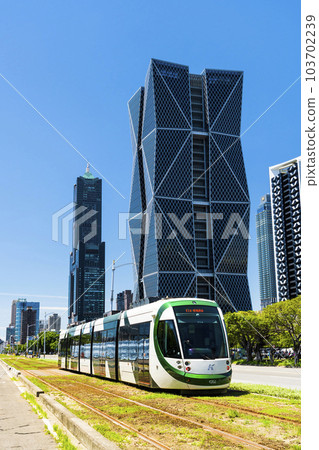 View of circular light rail train and the metropolitan building in Kaohsiung, Taiwan. The Circular Light Rail System in Kaohsiung is the first in Taiwan. 103702239