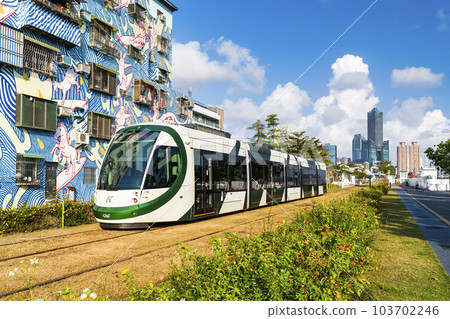 The circular light rail train drives past Pier-2 Art Center in Kaohsiung, Taiwan. 103702246