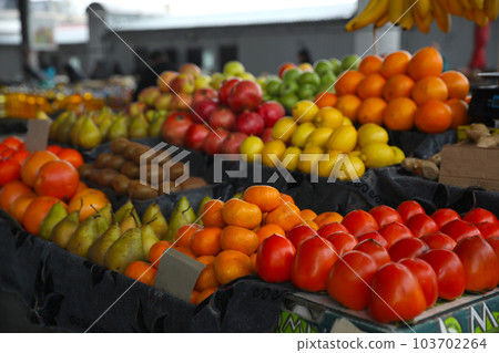 Tasty fresh fruits on counter at wholesale market Tasty fresh fruits on counter at wholesale market 103702264