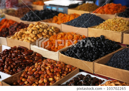 Delicious dried fruits on counter at wholesale market Delicious dried fruits on counter at wholesale market 103702265
