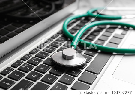Stethoscope on laptop, closeup. Concept of technical support 103702277