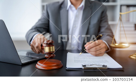 Justice and law concept.Male judge in a courtroom the gavel, working with digital tablet computer. Justice and law concept.Male judge in a courtroom the gavel, working with digital tablet computer. 103703154