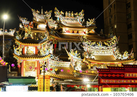 Night view of the Songshan Ciyou Temple in Taipei, Taiwan, The temple is dedicated to the Goddess Matsu. 103703406