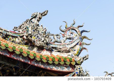 Close-up of decorative art on the rooftop of Wanhua Longshan Temple in Taipei, Taiwan. 103703409