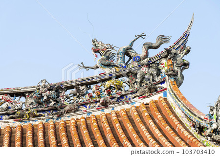 Close-up of decorative art on the rooftop of Wanhua Longshan Temple in Taipei, Taiwan. 103703410