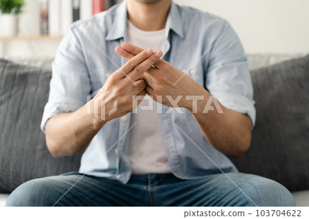 Happy young deaf man using sign Language to communicate with other people.. 103704622