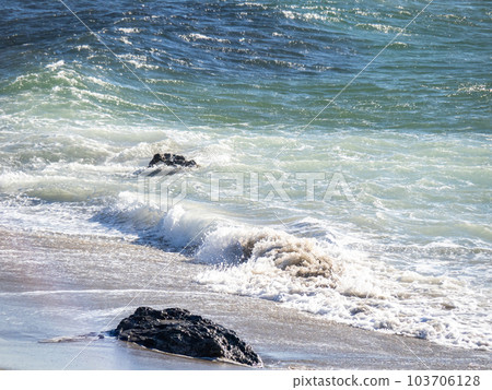 Whitecaps and splashes on the beach of the strong wind sea. Whitecaps and splashes on the beach of the strong wind sea. 103706128