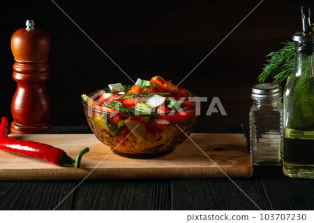 Fresh vegetable salad in a plate in restaurant kitchen. Cooked healthy food with a set of vitamins 103707230