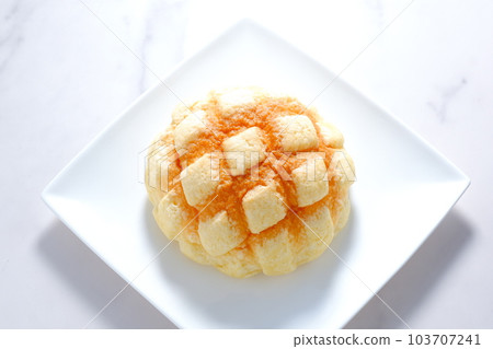 Delicious melon bread on a white plate Delicious melon bread on a white plate 103707241