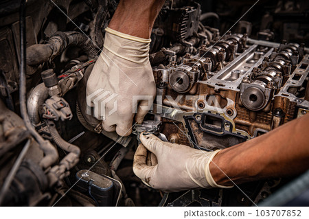 Auto mechanic working Auto mechanic working 103707852