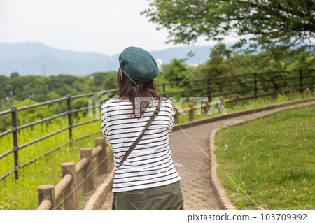 A person strolling through the park space in the Akagi Kogen Service Area A person strolling through the park space in the Akagi Kogen Service Area 103709992