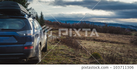 car for traveling with a mountain road 103711306