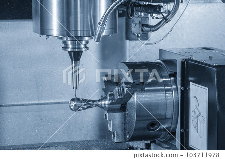 The 4-axis CNC milling machine  cutting the sample part with solid ball end mill tool. 103711978