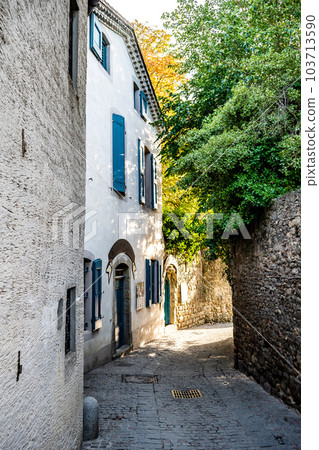 Narrow Alley With Ancient Buildings In The Ancient Fortress Of Medieval City Carcassonne In Occitania, France 103713590