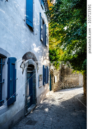 Narrow Alley With Ancient Buildings In The Ancient Fortress Of Medieval City Carcassonne In Occitania, France 103713591