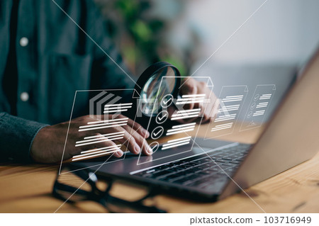 A man examines a paper using a magnifying lens, representing business analysis, auditing, professional document review, inquiry, and inspection, all essential concepts in the field. 103716949