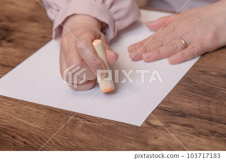 [Woman stamping stamp] 103717183